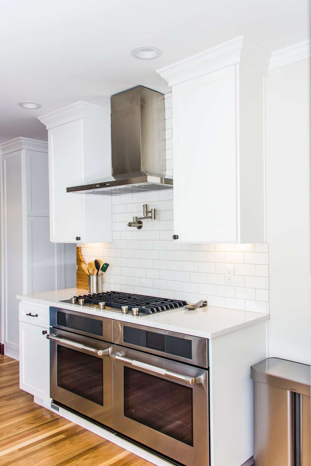 White kitchen with red oak floors