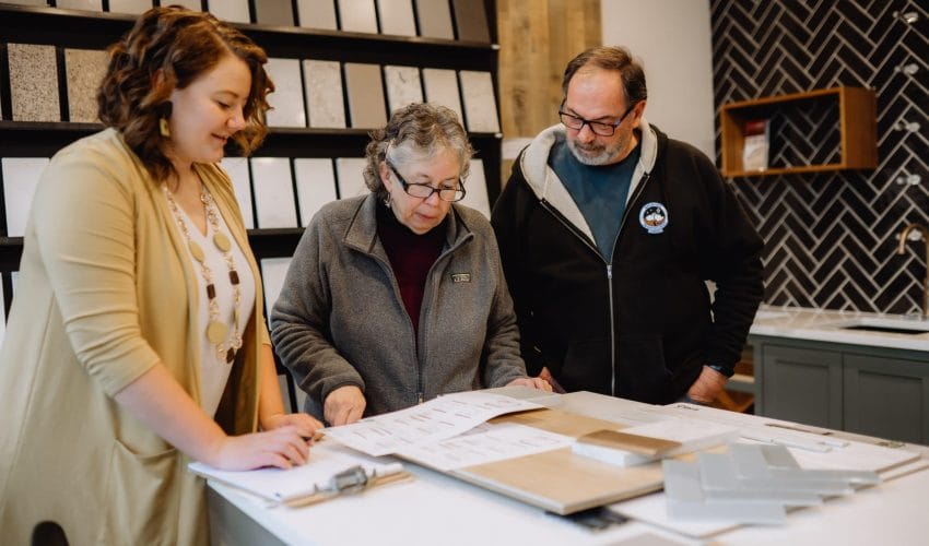 Client consultation reviewing plans and design