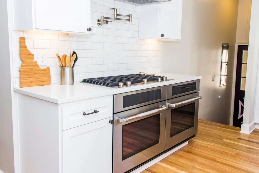 Kitchen with white cabinets and white countertop
