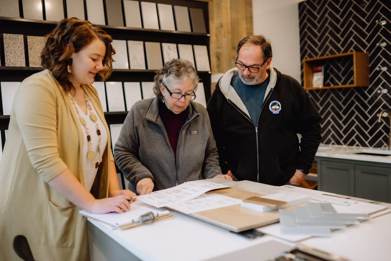 Client consultation reviewing plans and design
