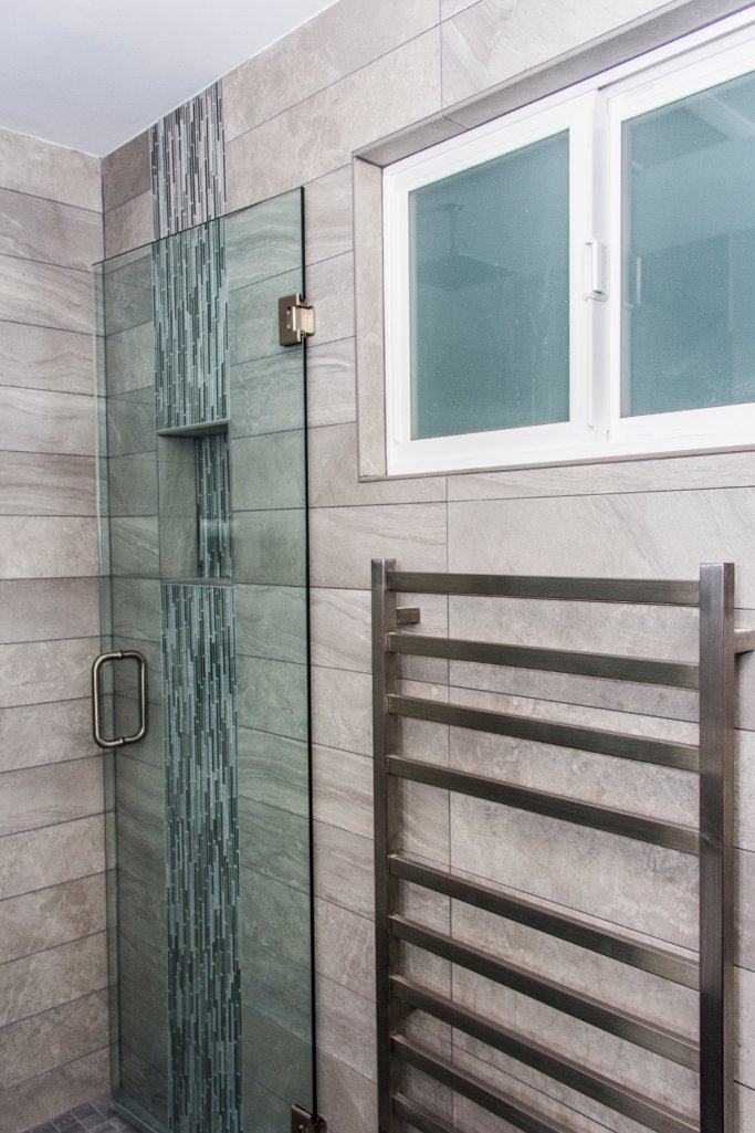Seamless tile shower and towel warmer